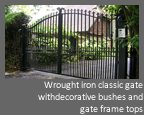 Automatic, Electric hinged gate - Wrought iron classic gate with decorative bushes and gate frame tops