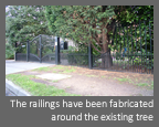 Automatic, Electric hinged gate - The railings have been fabricated around the existing tree